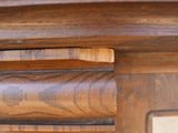 a close up of a wooden table with a clock on it