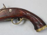 an old gun that is on display on a table
