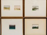 four framed photographs of watercolors of a beach and a body of water
