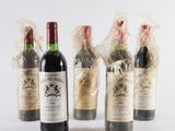 several bottles of wine are wrapped in plastic bags on a white surface