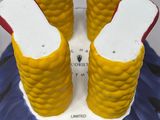a cake that has corn on the cob on it