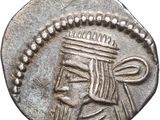 a close up of a silver coin with a crown on it