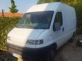 a white van that is parked on the side of the road