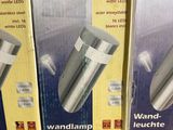 three boxes of smart lamp on a shelf in a store