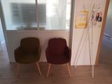 two chairs sitting next to each other in a room
