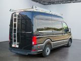 an image of a black van parked in a garage