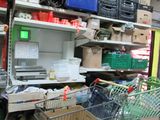 a shopping cart that is sitting in front of a shelf