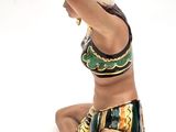 figurine of a woman in a bikini sitting on the ground