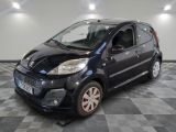 a picture of a small black car on a checkered floor
