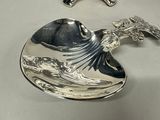 two spoons and a bowl sitting on a table