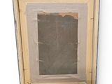 an old picture frame with a picture of a person in it