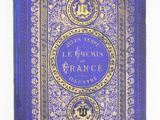 un livre bleu avec des bordures dorées et une couverture bleue