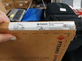 a person holding a box that has a label on it