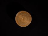 an image of a coin on a black background