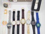 a lot of watches and a watch case on the table