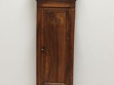 a grandfather clock in the corner of a room