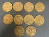 six gold sovereigns are arranged in a circle on a table
