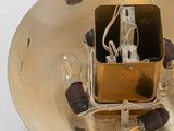 an overhead view of a light fixture with a light bulb in it
