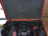 an open tool case with tools in it sitting on a table