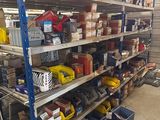 many different types of tools on the shelves in the garage