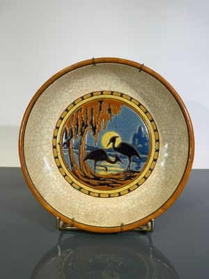 a plate with a picture of a horse on it on a table