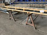 many pieces of glass on the table in the warehouse