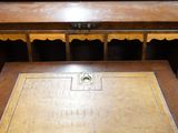 a wooden desk with a wooden top and drawers