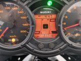 a close up of a speedometer and gauges on a motorcycle