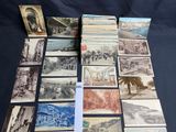 some old postcards are laying out on a table
