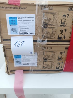 a box with a red ribbon on it sitting on a table