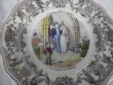 a plate with a picture of a man and a woman on it