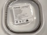 a picture of a white toilet with a plastic lid