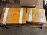 two boxes of construction materials sitting on a table