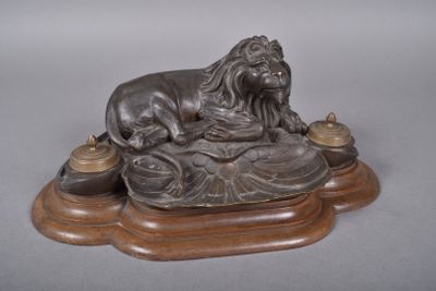 a statue of a lion sitting on top of a table