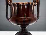 an image of a brown vase sitting on top of a white table