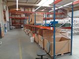 a large warehouse with a lot of boxes on the shelves