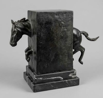 an image of a statue of a horse jumping over a pillar