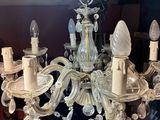 a chandelier that has a lot of glass hanging from it