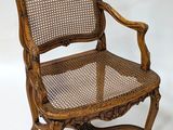 an image of a wooden chair with cane back and cane seat