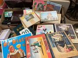 a lot of books that are sitting on the floor