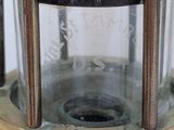 an old fashioned brass lantern with a glass top