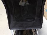 a baby stroller that has a umbrella on the back of it