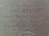 the headstone of a man and a woman in a cemetery