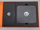 an orange box with a black and white logo on the inside of it