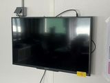 a flat screen tv mounted on a wall in a room