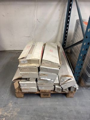 a stack of boxes sitting on a pallet in a warehouse