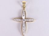 a yellow gold cross pendant with diamonds on a white background