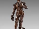 a bronze statue of a man with a dog on a rock