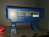 an image of a blue machine sitting on top of a table