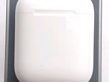 an apple airpods with a charging case in the box